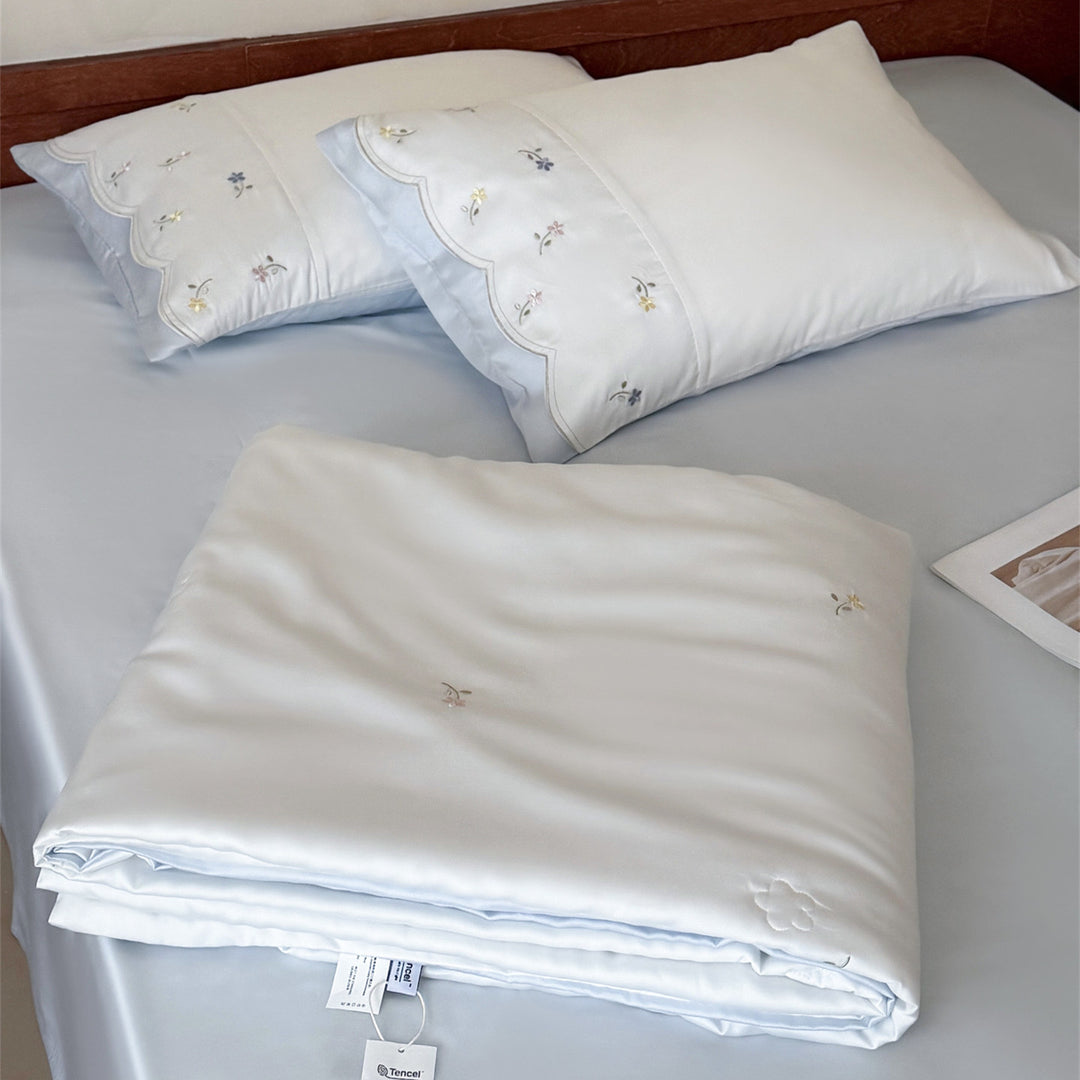 Embroidered satin bedding set with fine floral embroidery and silky-soft touch