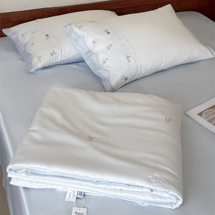 Embroidered satin bedding set with fine floral embroidery and silky-soft touch