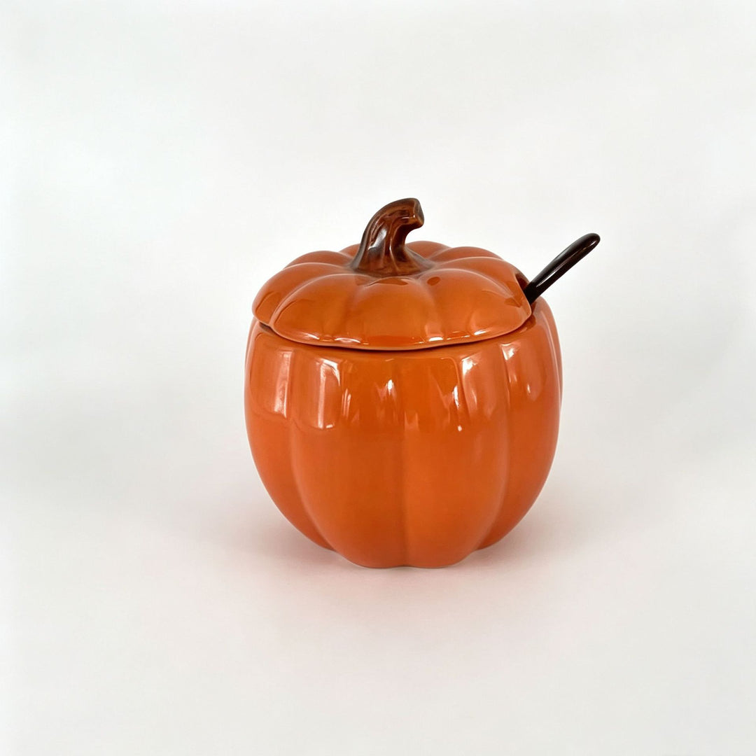 Ceramic storage jar in pumpkin shape with lid and spoon