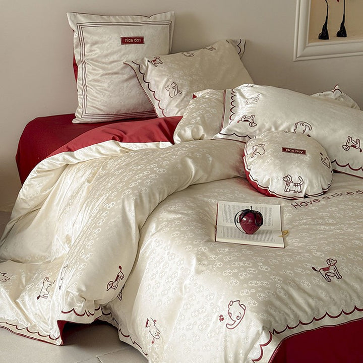 Satin bed linen set with shiny finish, featuring a two-color reversible function and animal embroidery