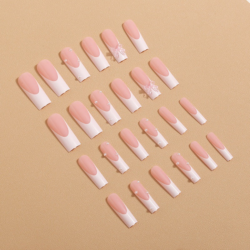 Artistic nail extensions with pearls and bows decorations Kalsten
