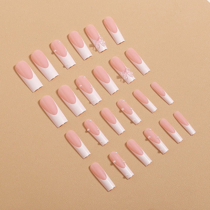 Artistic nail extensions with pearls and bows decorations Kalsten