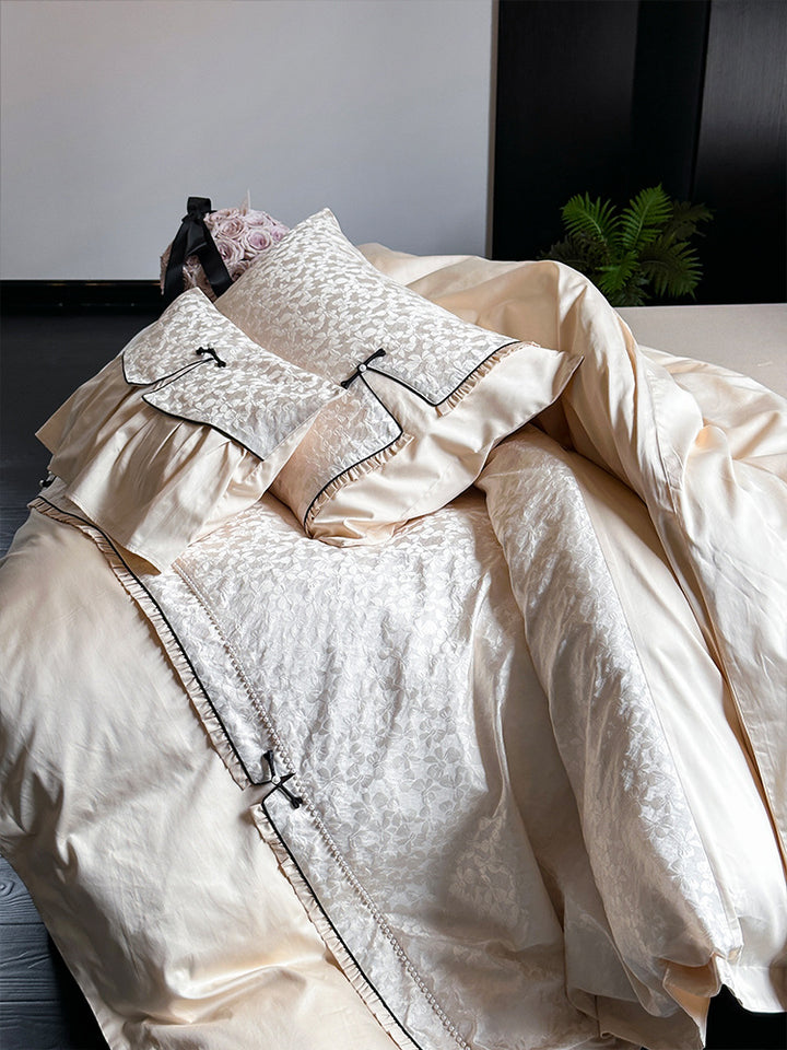 Elegant jacquard bedding set with floral relief structure, ruffles and contrasting piping