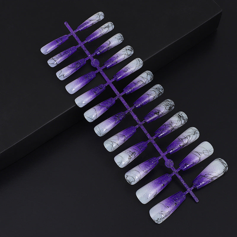 Artificial nails in modern ombre design with marbled accents Kalsten
