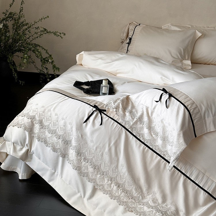 Fine cotton satin bedding set with lace ruffle, contrasting decorative ribbons and hotel closure