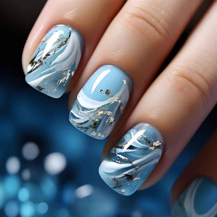 Acrylic nail set with luxurious marble design and gold accents Kalsten