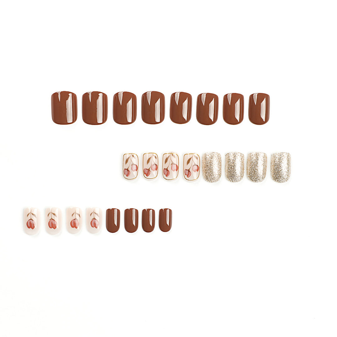 Artificial nail art with colorful flower design and glitter accents Kalsten