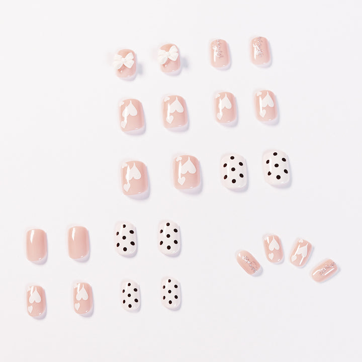 Artful nail art with delicate flower and heart motifs Kalsten