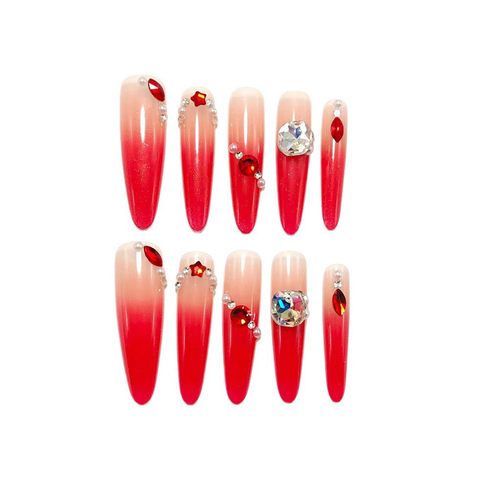 Artificial nails in elegant ombre style with glitter and jewelry accents Kalsten