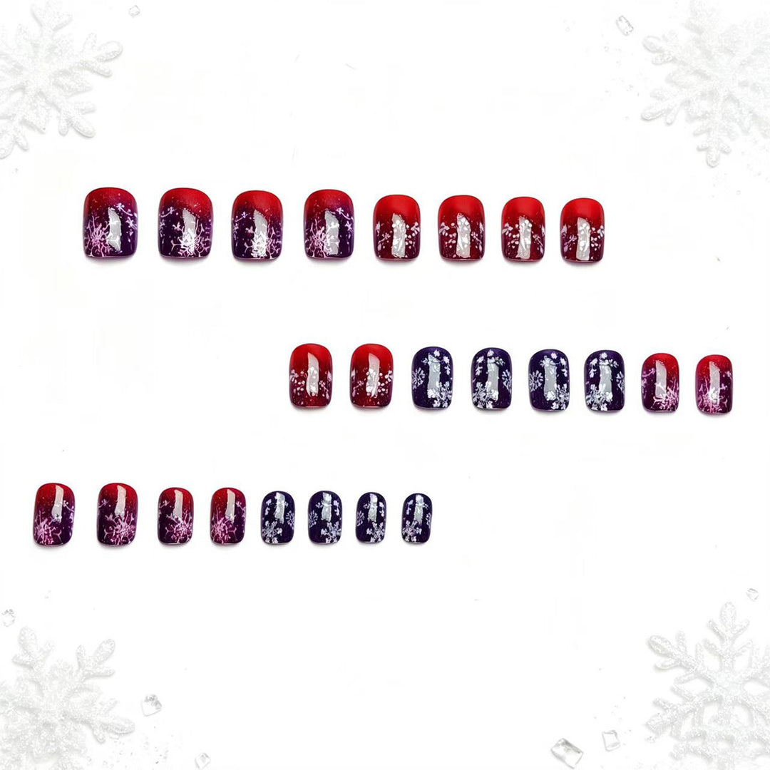Artificial nails with festive glitter effect and wintry snow motif Kalsten