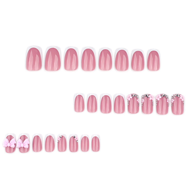 Artful nail extensions with sparkling accents and bow decorations Kalsten