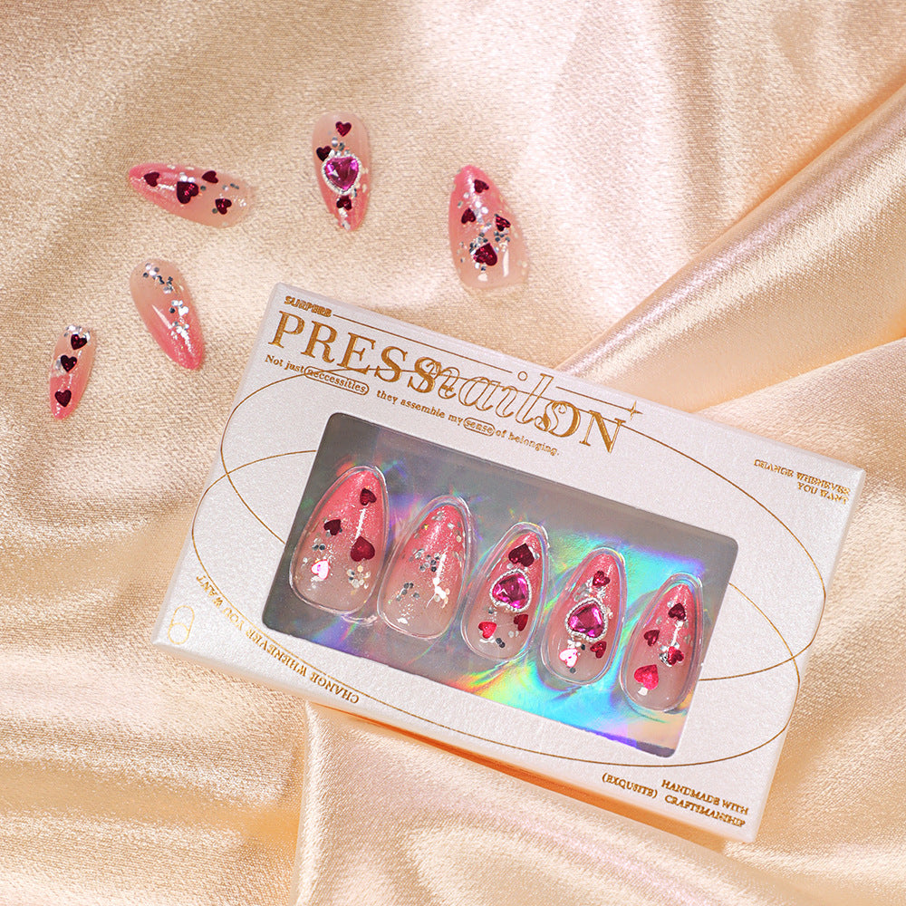 Artful nail art with playful heart designs and glitter Kalsten