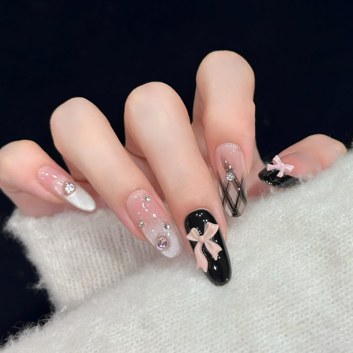 Artificial nail tips with elegant bows and glitter details Kalsten