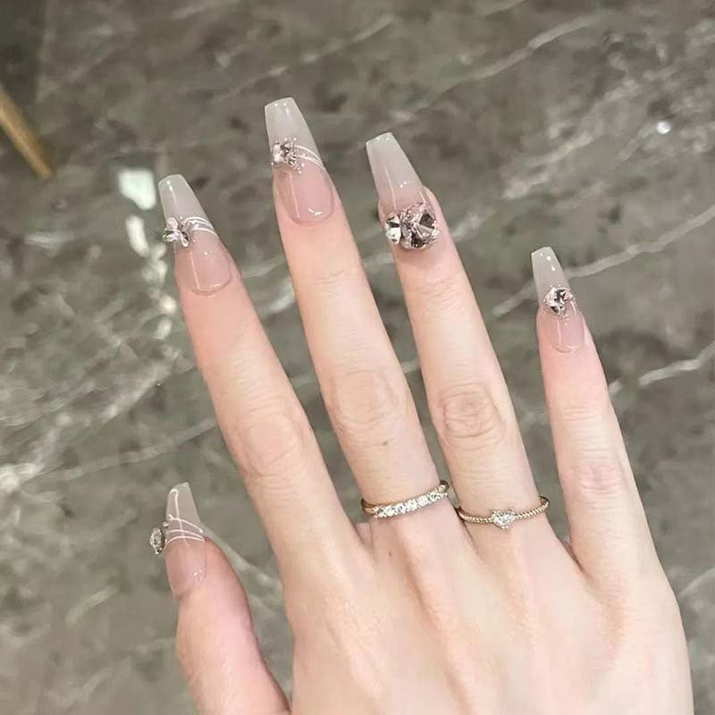 Art nail set with filigree decorations and glamorous accents Kalsten