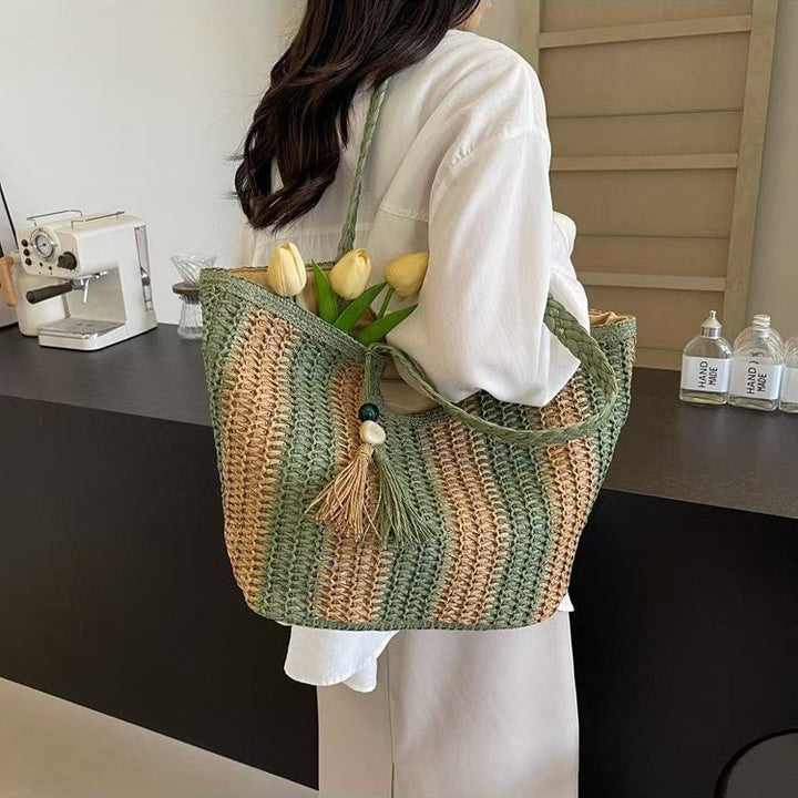 Handcrafted straw bag with elegant tassels and detailed texture Kalsten