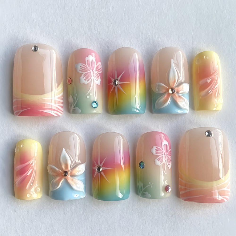 Acrylic nails with floral accents and gradient Kalsten