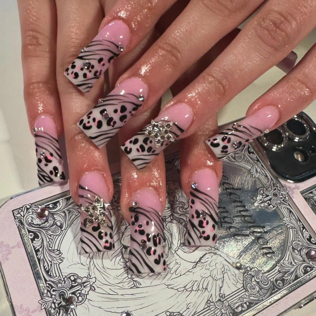 Artful Nail Art with Zebra Pattern and Glitter Accents Kalsten