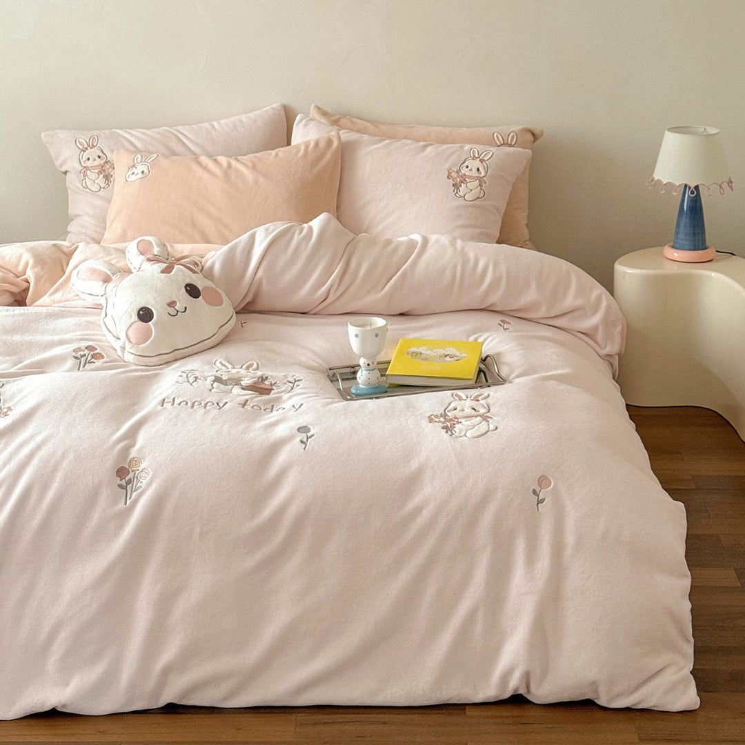 Cute children's bedding set made of soft cotton terry with embroidered cat appliqués and cuddly plush pillow.