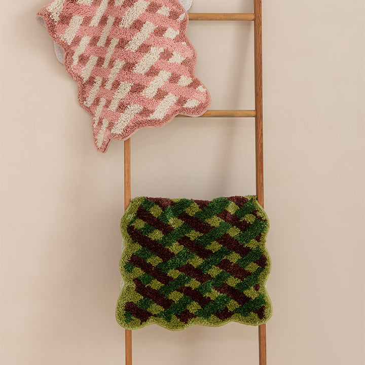 Tufted bathroom runner with wavy hem and relief-style braided pattern Kalsten