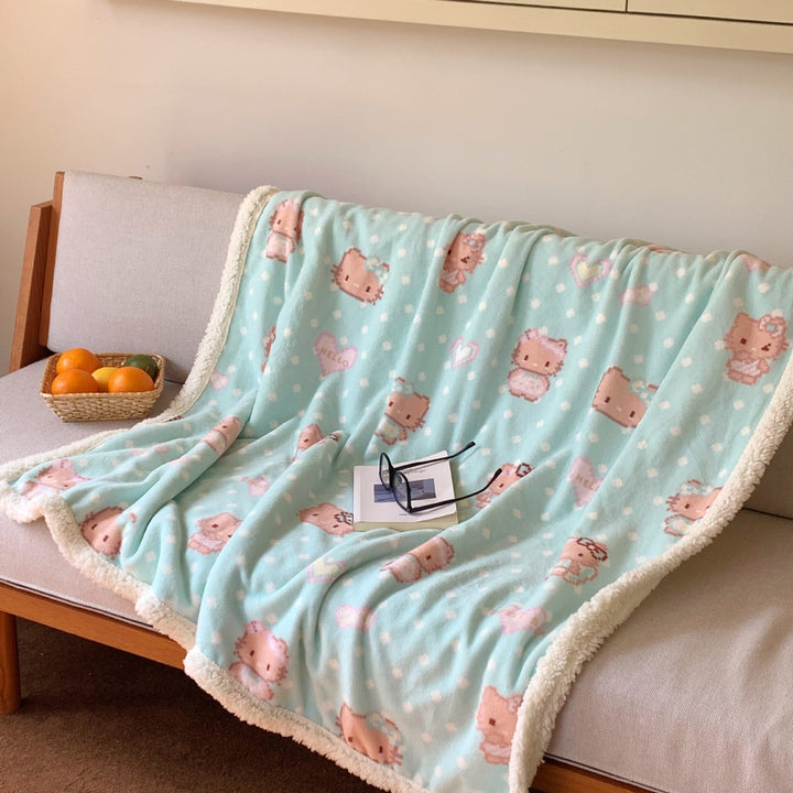 Reversible fleece blanket with cartoon cat design and teddy lining