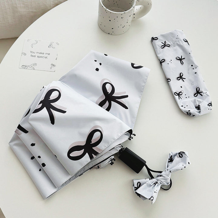 Women’s Folding Umbrella with Playful Bow Pattern Kalsten