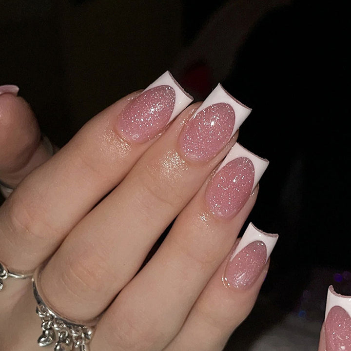 Artful nail decorations with glitter and French tip Kalsten