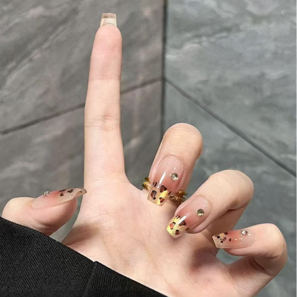 Artificial nails with elegant leopard pattern and glitter accents Kalsten