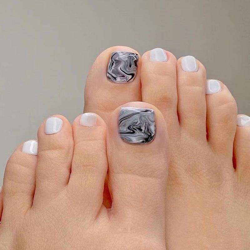 Artful toenail art in elegant marble design Kalsten