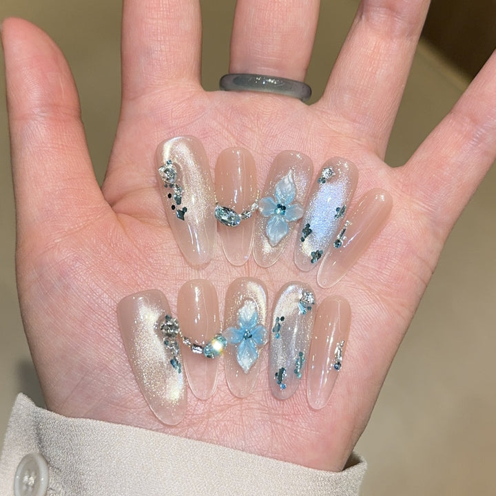 Artificial nails with unique floral design and glitter accents Kalsten