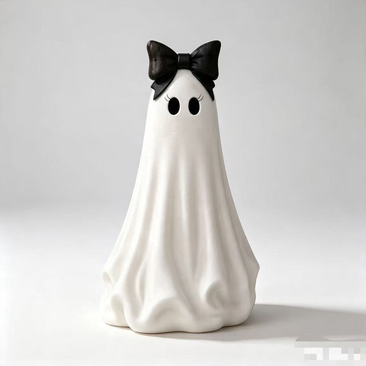 Playful ceramic decorative figure in ghost form with bow detail