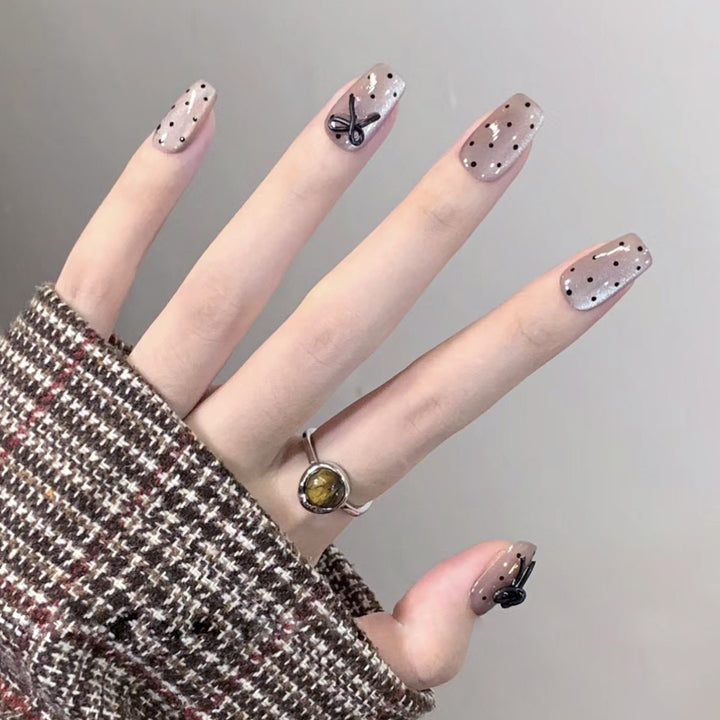 Artful Nail Extensions with Bow Pattern Kalsten