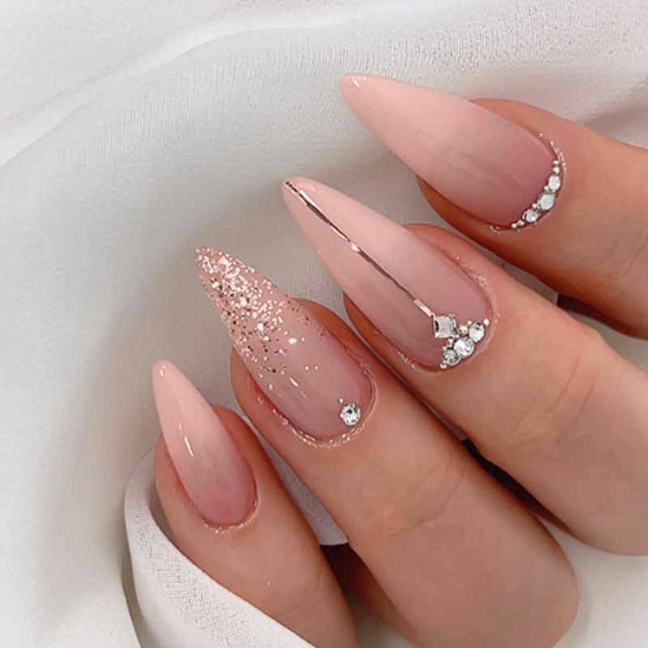 Glamorous artificial nails with rhinestone accents and shimmering effects Kalsten