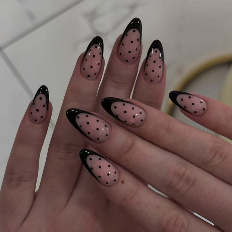 Artistic stiletto nails with black dot pattern Kalsten