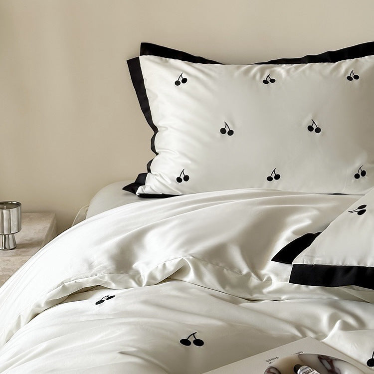 Luxurious satin bedding set with cherry embroidery and contrasting trim