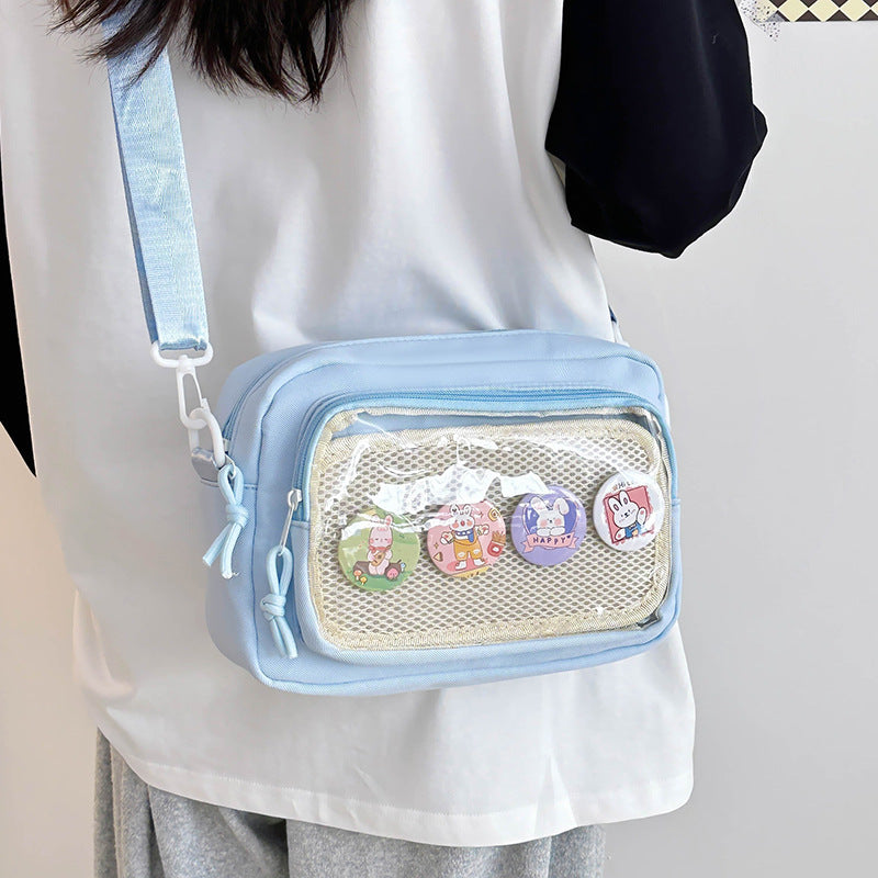 Shoulder bag with transparent viewing pocket and playful graphic design Kalsten