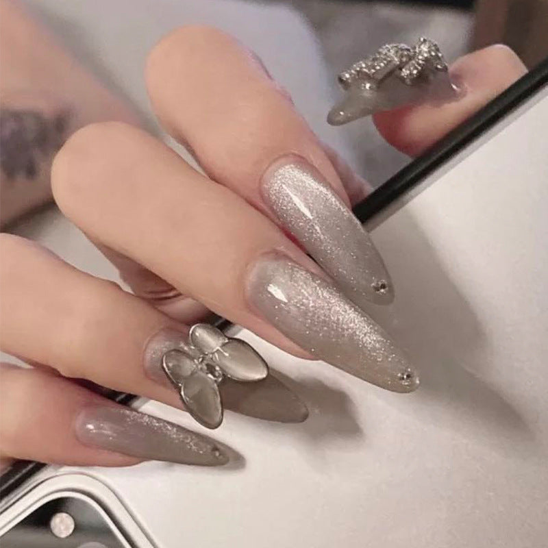 Glamorous stiletto nails with radiant glitter and elegant 3D design Kalsten