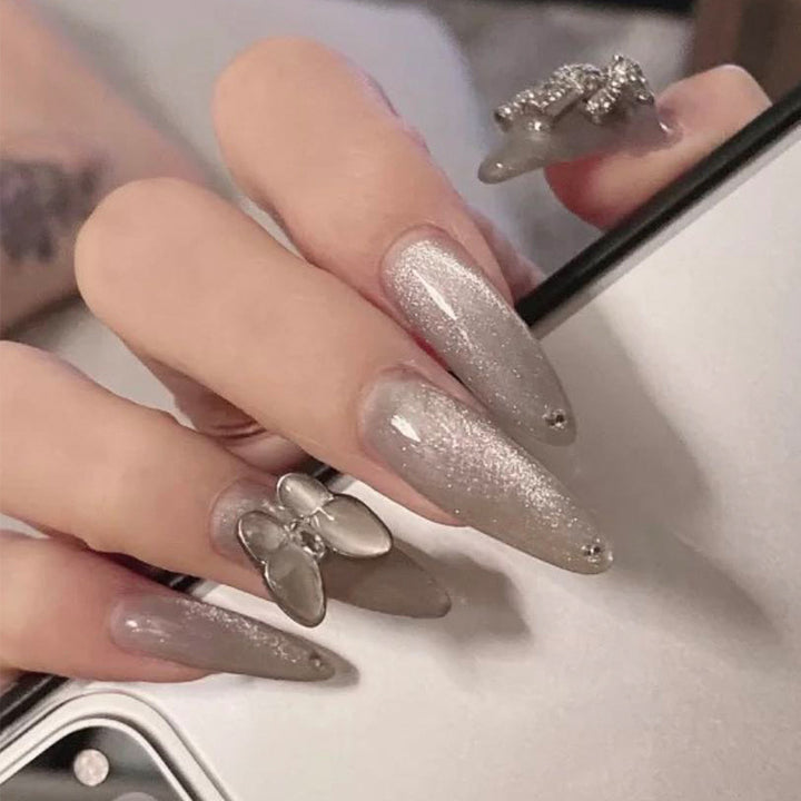 Glamorous stiletto nails with radiant glitter and elegant 3D design Kalsten