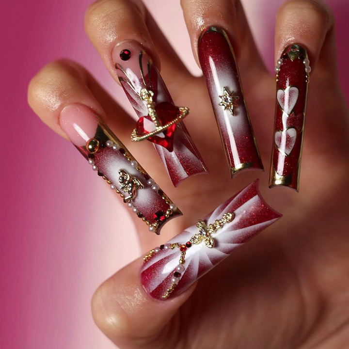 Artistic Nail Art with Glitter and Heart Designs Kalsten