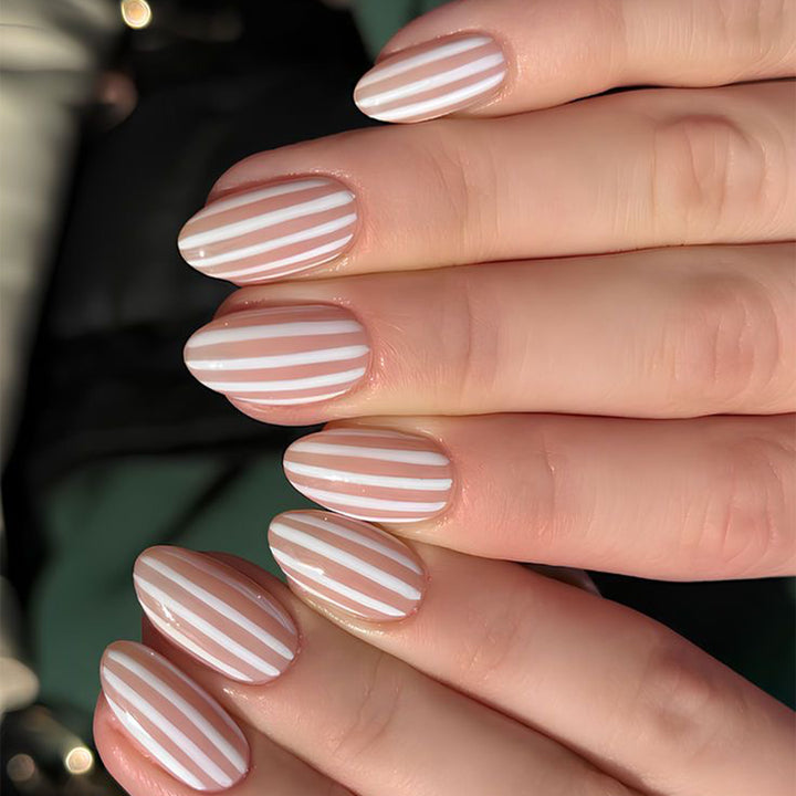 Stylish nail art with elegant stripe patterns Kalsten