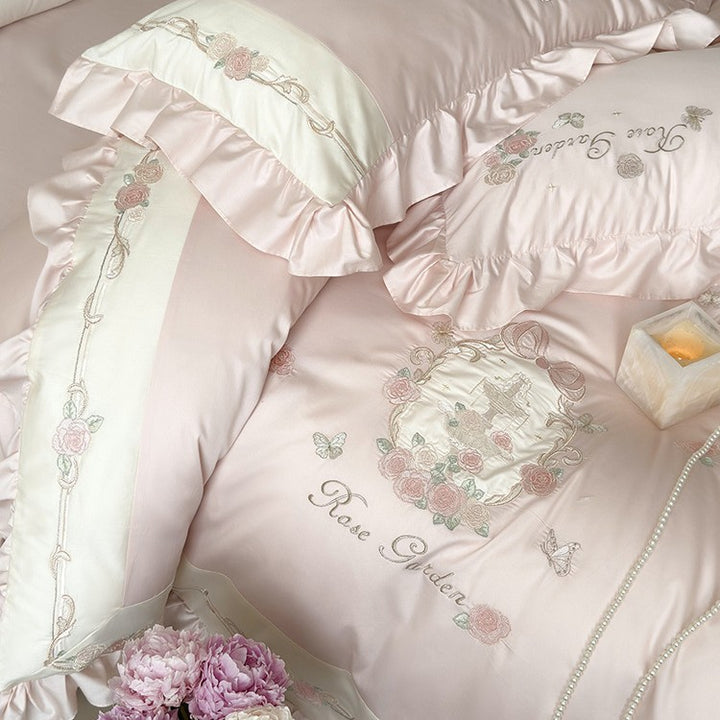 Delicate embroidered cotton satin bedding set with ruffle, satin trim, and rose motif