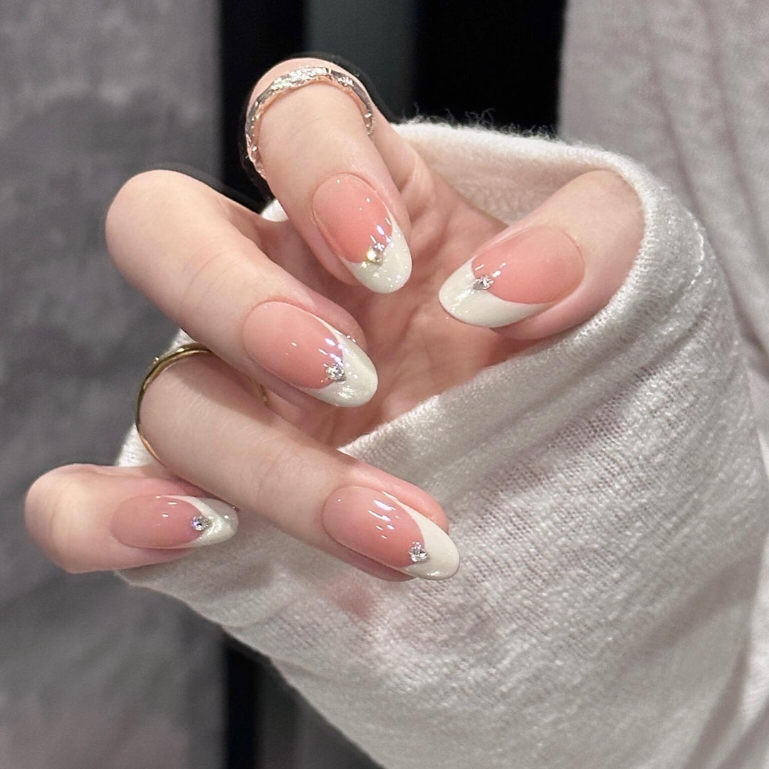 Artificial nails with elegant French style and sparkling accents Kalsten