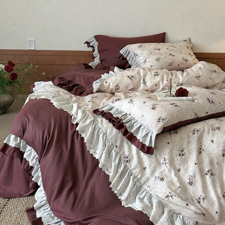Romantic bed linen set with lace trim, ruffles, and fine floral print