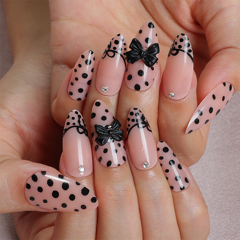 Creative nail art set with elegant dots and bow decorations Kalsten