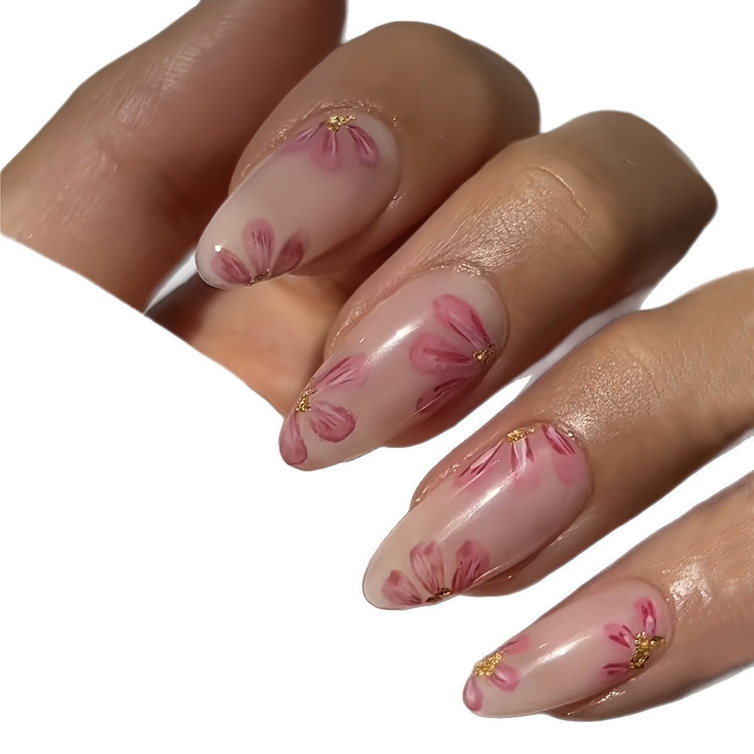 Artificial nail set with floral accents and gold embellishments Kalsten