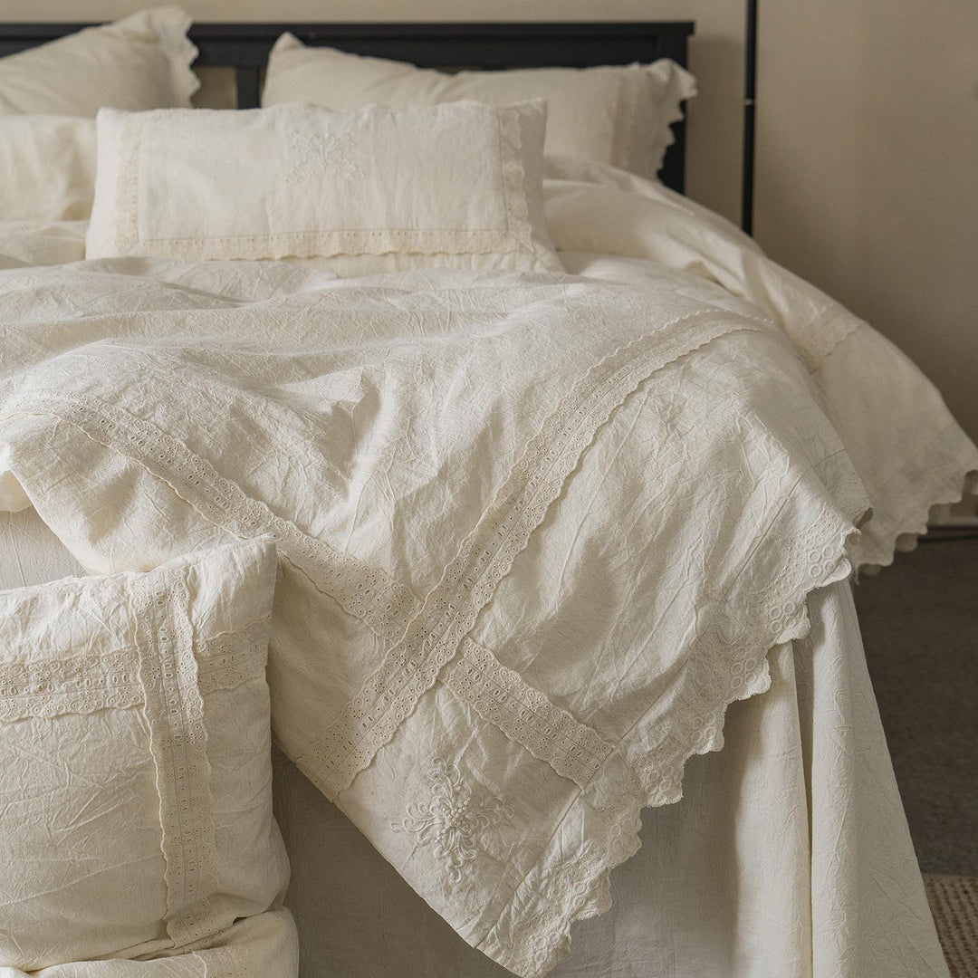 Bed linen set in vintage linen style with lace trim and embroidery detail