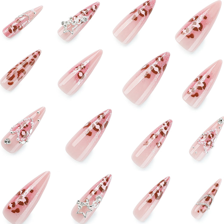 Artistic stiletto nails with glitter and jewelry accents Kalsten