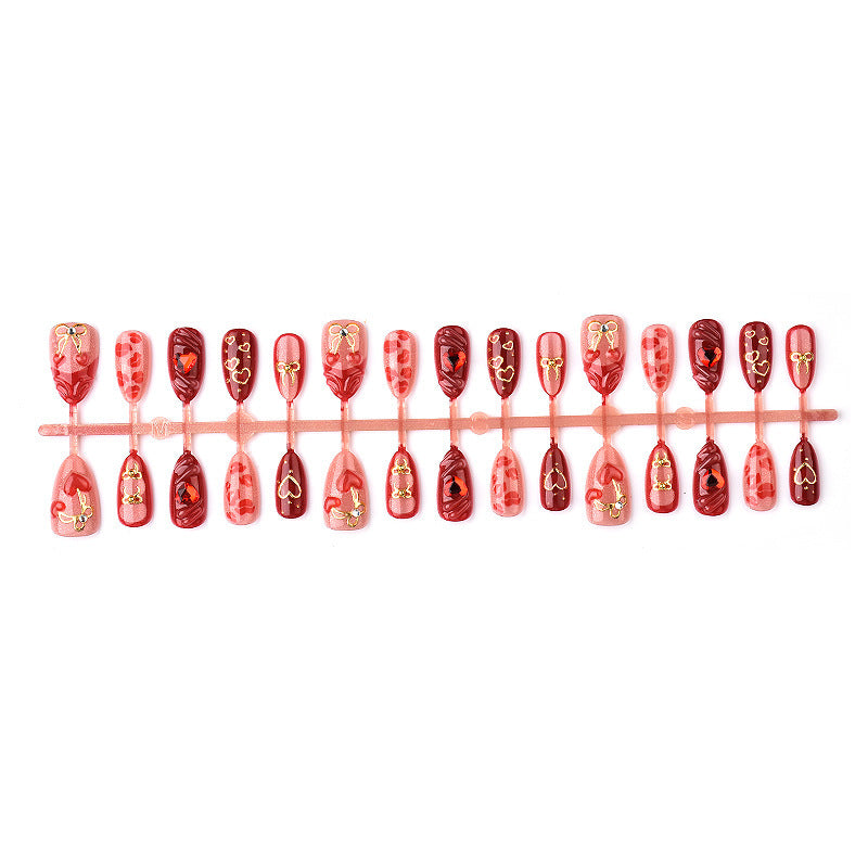 Festive artificial nails with romantic heart designs Kalsten