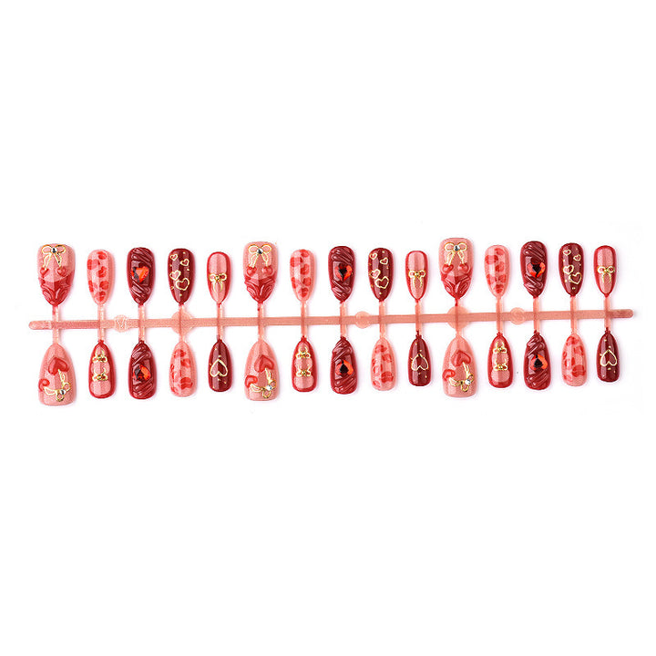 Festive artificial nails with romantic heart designs Kalsten