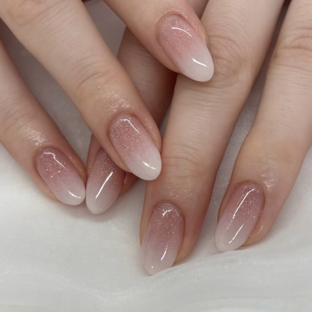 Luxurious nail extensions with elegant glitter ombre coating Kalsten