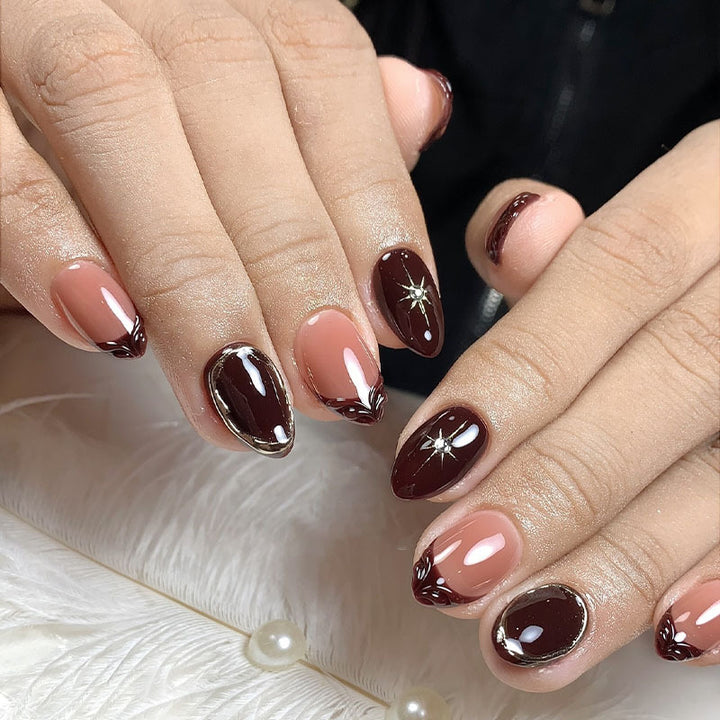 Acrylic nail set with elegant gradient and delicate embellishments Kalsten